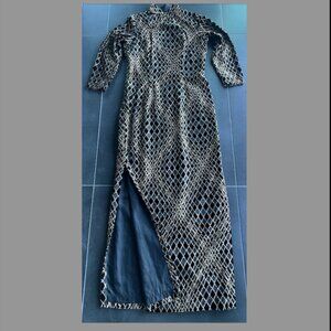 Oriental elegant long cheongsam in black and gold pattern